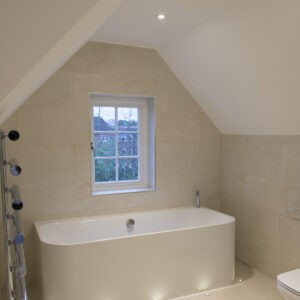 Chrome Detachable Square Bezel lighting a bathtub in the bathroom creating a soft and warm atmosphere